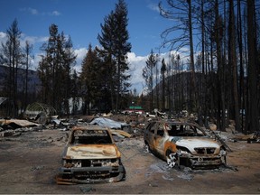 Burned vehicles are seen at a property destroyed by the Bush Creek East wildfire, in Scotch Creek in early September.