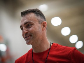 Toronto Raptors head coach Darko Rajakovic walks off the court to talk to reporters during the opening day of the NBA basketball team's training camp, in Burnaby, B.C., on Tuesday October 3, 2023.