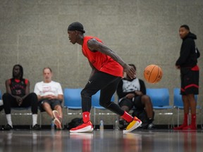 The ball slips out of Toronto Raptors point guard Dennis Schroder's hands as he shoots around during the opening day of the NBA basketball team's training camp, in Burnaby, B.C., on Tuesday October 3, 2023.