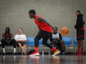 The ball slips out of Toronto Raptors point guard Dennis Schroder's hands as he shoots around during the opening day of the NBA basketball team's training camp, in Burnaby, B.C., on Tuesday October 3, 2023.