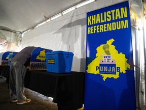 A person votes during the Khalistan referendum vote in the at the Guru Nanak Sikh Gurdwara in Surrey, B.C, Sunday, Oct. 29, 2023.