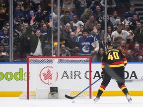 Vancouver Canucks' Elias Pettersson scores his third goal against the Nashville Predators into an empty net during the third period on Tuesday night.