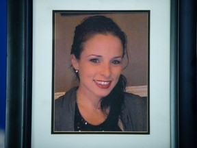 A photograph of Ashley Simpson, an Ontario woman who went missing in B.C. in 2016, is displayed during an Dec. 6, 2021 RCMP news conference to announce that charges have been laid in her murder.