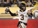 B.C. Lions quarterback Vernon Adams Jr. (3) throws on the run during CFL football game action against the Hamilton Tiger-Cats in Hamilton, Ont. on Friday, October 13, 2023. His role in the B.C. Lions' 33-30 road win over the Hamilton Tiger-Cats earned Adams a spot in the CFL's weekly honour roll.