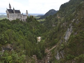 FILE - A view of the Pollat gorge with the Neuschwanstein castle, in background in Schwangau, Germany, June 16, 2023. An American man has been charged with murder and other offenses for attacking two women from the U.S. near Neuschwanstein castle in Germany in June and pushing them into a ravine, fatally injuring one of them, prosecutors said Thursday Oct. 26, 2023.