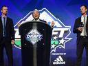 NHL commissioner Gary Bettman speaks while flanked by former Vancouver Canucks players Daniel Sedin and Henrik Sedin before the first round of the 2019 NHL Draft at Rogers Arena.