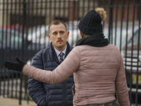 Josh Kruger, left, then the Communications Director, the Office of Homeless Services at City of Philadelphia, at a tent encampment in Philadelphia, on Jan. 6, 2020.