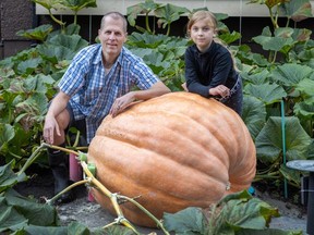 Mike Polay and his eight-year-old daughter Ellie with their giant pumpkin in Vancouver on Oct. 3.
