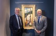 Robert and David Heffel with the Emily Carr painting Alert Bay (Indian in Yellow Blanket) at the Heffel Gallery in Vancouver.