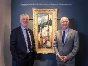 Robert and David Heffel with the Emily Carr painting Alert Bay (Indian in Yellow Blanket) at the Heffel Gallery in Vancouver.