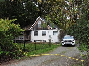 Homicide investigators in the 24300-block of 8th Avenue in Langley following the discovery of a body after an explosion on Oct. 22, 2023.