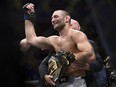 Sean Strickland celebrates defeating Israel Adesanya to claim the middleweight title.