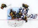 Thatcher Demko is surrounded by defenders as the Canucks battle the Edmonton Oilers earlier this month.