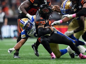 B.C. Lions quarterback Vernon Adams Jr. is sacked by Blue Bombers' Jackson Jeffcoat during their game, in Vancouver, on Oct. 6, 2023.