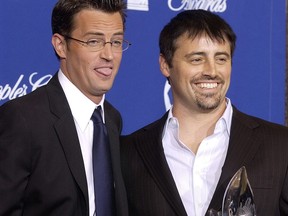 Matthew Perry and Matt LeBlanc joke around with the award they won for favourite television comedy series at the 30th Annual People's Choice Awards Sunday, Jan. 11, 2004 in Pasadena, Calif.