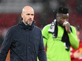 Erik ten Hag, Manager of Manchester United, looks dejected after the team's defeat in the Premier League match between Manchester United and Manchester City at Old Trafford on October 29, 2023.