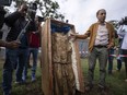 Abdelaziz El Khayari, a professor of pre-Islamic archaeology from Morocco’s National Institute of Archaeological Sciences and Heritage, shows reporters a recently discovered statue of a woman draped in cloth, in Chellah necropolis in Rabat, Morocco, Friday, Nov. 3, 2023.