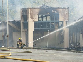 Port Coquitlam firefighters put out a fire at Hazel Trembath Elementary on Oct. 14, 2023. The overnight fire destroyed much of the school.