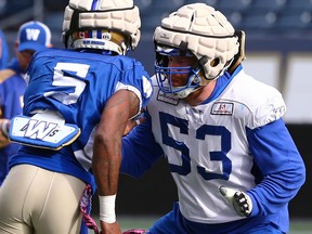 Offensive lineman Pat Neufeld, here blocking Willie Jefferson during a recent practice, says he expects the B.C. Lions to throw everything they have at his Blue Bombers tomorrow at IG Field.
