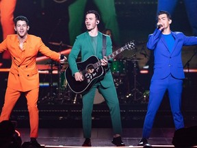 Nick Jonas, Joe Jonas and Kevin Jonas of the Jonas Brothers perform onstage during the Happiness Begins Tour at the AT&T Center on Sept. 27, 2019, in San Antonio, Tex.