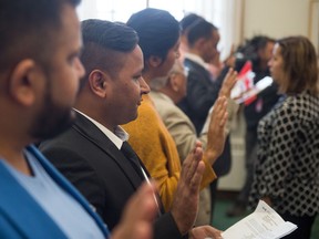 New Canadians swear an oath at the Saskatchewan Legislative building in 2017. Canada is raising immigration targets in 2025, but keeping them level the following year.