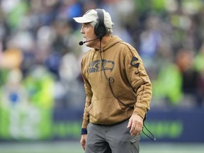 Seattle Seahawks coach Pete Carroll looks on in the first half of an NFL football game against the Washington Commanders in Seattle, Sunday, Nov. 12, 2023.