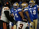 Winnipeg Blue Bombers' Jackson Jeffcoat (94) celebrates his sack of B.C. Lions quarterback Vernon Adams Jr. (3) during first half CFL action in Winnipeg Saturday, November 11, 2023.