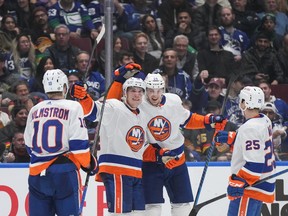 New York Islanders' Bo Horvat, centre left, Scott Mayfield, centre right, Sebastian Aho, right, and Simon Holmstrom celebrate Horvat's goal against his former team during the second period on Wednesday night at Rogers Arena.