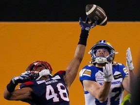 Montreal Alouettes defensive back Kabion Ento (48) knocks down a pass intended for Winnipeg Blue Bombers wide receiver Drew Wolitarsky (82) during the first half of football action at the 110th CFL Grey Cup in Hamilton, Ont., on Sunday, November 19, 2023.