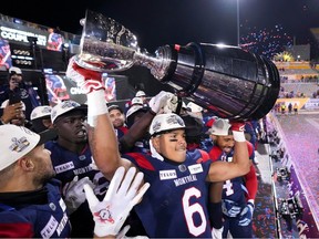 Montreal Alouettes wide receiver Tyson Philpot (6) hoists the Grey Cup as the Alouettes celebrate defeating the Winnipeg Blue Bombers in the 110th CFL Grey Cup in Hamilton, Ont., on Sunday, November 19, 2023.