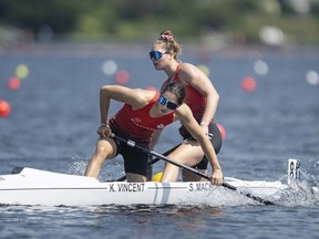 Katie Vincent, left, and teammate Sloan MacKenzie, of Canada, react at the finish line following the C2 women's 500m during the ICF Canoe Sprint and Paracanoe World Championships in Dartmouth, N.S. on Saturday, August 6, 2022.