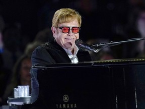 FILE - Elton John performs on the South Lawn of the White House in Washington, Friday, Sept. 23, 2022. Elton John is set to address Britain's Parliament on Wednesday, Nov. 29, 2023, on his work fighting HIV at an event to mark World AIDS Day. The British star's AIDS Foundation has led campaigns to extend a pilot government program to test people visiting hospitals' emergency departments for HIV.