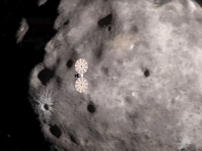 This image from a video animation provided by NASA depicts the Lucy spacecraft approaching an asteroid.