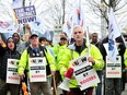 Locked out Rogers workers who are part members of the United Steelworkers Union (USW) attend a rally outside the Rogers/Shaw Tower at Jack Poole Plaza in Vancouver on Nov. 9, 2023.