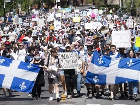 People take part in a demonstration against Bill 96 in Montreal, Saturday, May 14, 2022.