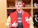 Boston University defenceman and Vancouver Canucks prospect Tom Willander wears the player of the game jacket after scoring the game-winner against rival Maine in a 3-2 win in NCAA play on Friday night.