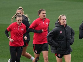 Canada's Christine Sinclair ,centre, and Sophie Schmidt, right, run during a training session at the FIFA Women's World Cup in Melbourne, Australia, Sunday, July 30, 2023. Captain Sinclair won't be the only player in the spotlight when Canada hosts Australia in Victoria and Vancouver next month. Veteran goalkeeper Erin McLeod and midfielder Schmidt, who have also called time on their international career, are also being honoured at the Vancouver game.