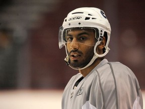 Prab Rai in a photo taken at a Vancouver Canucks' training session at Rogers Arena on Sept. 11, 2010. Rai was charged with fraud Tuesday, says Surrey RCMP.
