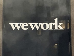 The WeWork logo appears on a building exterior in New York on Tuesday, Nov. 7, 2023.