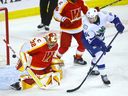 Linus Karlsson takes a shot on Calgary Wranglers goalie Dustin Wolf in last year's playoffs. Karlsson impressed head coach Rick Tocchet in his NHL debut versus Calgary two weeks ago and was recalled Wednesday.