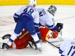 File photo: The Abbotsford Canucks and Calgary Wranglers battle in the AHL playoffs in April.