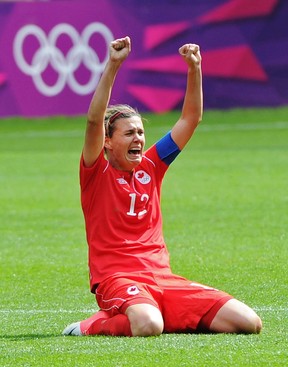 Canada #12 Christine Sinclair celebrates a 1 - 0 victory over France in the bronze medal match in City of Coventry Stadium at the London Olympics, August 9, 2012. The photographer Ed Kaiser won a National Newspaper Award for this photo