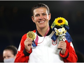 YOKOHAMA, JAPAN - AUGUST 06: Gold medalist Christine Sinclair of Team Canada poses with their gold medal during the Women's Football Competition Medal Ceremony on day fourteen of the Tokyo 2020 Olympic Games at International Stadium Yokohama on August 06, 2021 in Yokohama, Kanagawa, Japan.