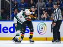 Nikita Zadorov, right, of the Vancouver Canucks fights Pat Maroon of the Minnesota Wild during the third period of their NHL game at Rogers Arena on Dec. 7.