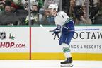 Conor Garland celebrates after scoring a goal during the third period against the Dallas Stars on Dec. 21, 2023.
