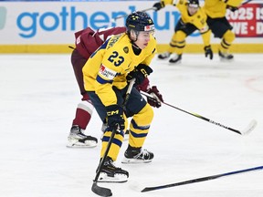 Sweden's Jonathan Lekkerimaki vies for the puck during the Group A ice hockey match between Sweden and Latvia of the IIHF World Junior Championship in Gothenburg, Sweden on December 26, 2023. (Photo by Bjorn LARSSON ROSVALL / TT News Agency / AFP) / Sweden OUT