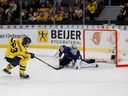 Sweden's Jonathan Lekkerimaki (L) scores a goal past Finland's goalkeeper Noa Vali during penalty shot shootouts at the Group A ice hockey match between Sweden and Finland of the IIHF World unior Championship in Gothenburg, Sweden, on December 31, 2023.