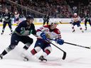 Edmonton Oil Kings' Jalen Luypen, right, battles Seattle Thunderbirds' Sawyer Mynio during WHL Championships' action at Rogers Place in Edmonton on June 3, 2022.