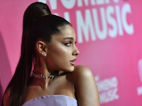 Two Christmas songs by Ariana Grande have made the naughty list when it comes to workplace distraction.