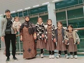 Gul Ahmadi, his wife Farida and their five girls pictured at the Islamabad International Airport before beginning their journey to Campbell River to start their new life.